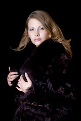 Image showing The young beautiful woman in a fur coat