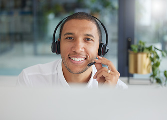 Image showing Smile, talking and portrait of a man in a call center for online support, consulting and advice. Happy, conversation and face of a customer service agent working in telemarketing, sales and helpline