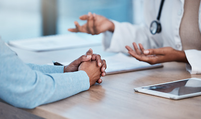 Image showing Doctor, patient and hands in healthcare consultation, diagnosis or medical help on office desk by hospital. Hand of nurse talking, consulting or breaking news to customer for life insurance or advice
