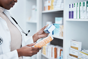 Image showing Black woman, pharmacy and choice with box, medicine and decision with prescription for healthcare. Pharmacist, drugs and pharmaceutical pills for health, wellness or medical store with stock on shelf