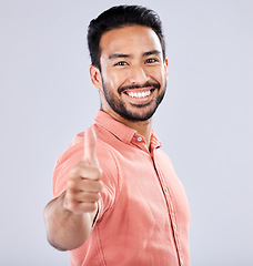 Image showing Thumbs up, yes and like with portrait of man for vote, well done and promotion for good news. Happy, smile and emoji with guy and positive hand gesture for thank you, agreement and approval in studio