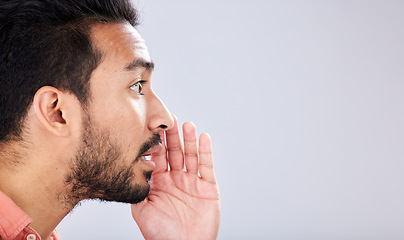 Image showing Whisper, talking and asian man with a secret on mockup isolated on a grey studio background. Announcement, space and guy speaking, sharing opinion and gossip for discussion and communication