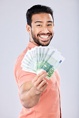 Image showing Showing, rich and portrait of Asian man with money isolated on a grey studio background. Finance, wealth and excited person holding cash from investment, lottery and winning the jackpot on a backdrop