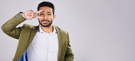 Image showing Portrait, peace and mockup with a business man in studio on a gray background for branding or advertising. Marketing, mock up and hand sign with a male employee indoor to promote product placement