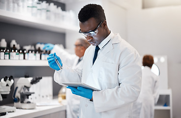 Image showing Science, research and black man in laboratory with tablet for medical analysis and digital innovation in medicine. Pharmaceutical analytics, web and scientist in South Africa checking results online.