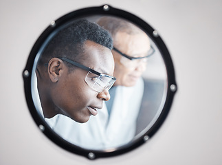 Image showing Science, research and black man in laboratory incubator window for experiment, study and medical test. Healthcare mockup, biotechnology and male scientists with concentration for sample storage