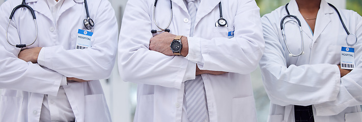 Image showing Doctors, arms crossed or diversity group in hospital for trust, healthcare wellness or life insurance support. Men, black woman or confident medical workers in community leadership of global clinic