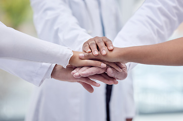 Image showing Doctors, nurses or hands stack in hospital motivation, team building or medical mission for goals, community or support. Zoom, women or healthcare diversity in teamwork circle or collaboration huddle