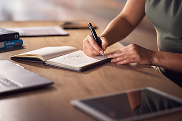 Image showing Business woman, hands or notebook writing in night office for company planning, schedule or ideas management. Zoom, corporate or worker with book, pen or tablet technology for evening project agenda