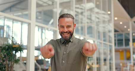 Image showing Business man, thumbs up and success portrait while walking in office for support, yes or thank you. Happy person excited about winning, goals or target at creative workplace with hands for like emoji