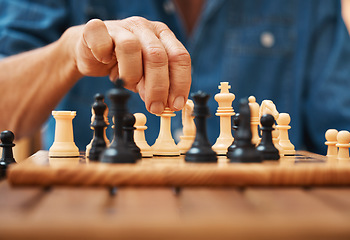 Image showing Play, chess and hands with a king on a board game with a strategy in tournament in home. Checkmate, chessboard and smart man or male playing in a sports contest or problem solving challenge for mind.