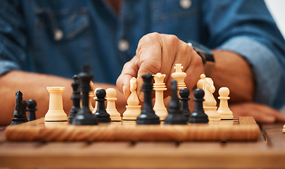 Image showing Chess, play and hands with a knight on a board game with a strategy in home competition. Checkmate, chessboard and smart man or male playing in a sports contest or problem solving challenge for mind.