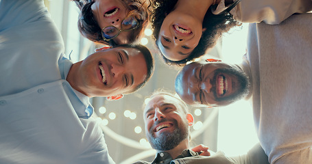 Image showing Teamwork, collaboration and huddle of business people in office or workplace with low angle. Team building, solidarity and group of employees hug for unity, union and motivation, goals and targets.