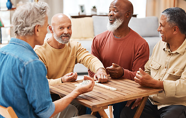 Image showing Senior men, friends and dominoes in board games on wooden table for activity, social bonding or gathering. Elderly group of domino players having fun playing and enjoying entertainment at home