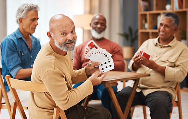 Image showing Showing, portrait and senior friends with cards for a game, playing and bonding in a house. Smile, show and elderly group of men in a nursing home for poker, games and competitive for fun together