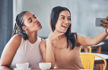 Image showing Women friends, coffee shop and smartphone for selfie, happy or solidarity with beauty on social network. Gen z black woman, phone and relax in cafe for blog, profile picture or photography on web app