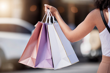 Image showing Woman, hands and holding shopping bags in city street, road or relax urban for sales, deals or commerce discount. Customer, consumer and retail person with gifts, promotion present or fashion parcel