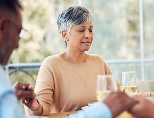 Image showing Praying, grace and mature woman and family praise God before dinner or supper as gratitude being spiritual. Holding hands, religion and thankful Christian people in hope, worship and prayer