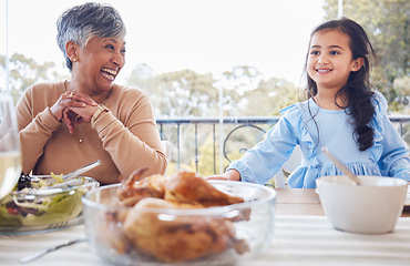 Image showing Family, food and grandmother with girl a table for lunch, part or social gathering on a patio. Love, dinner and senior woman laughing with grandchild while sharing a meal, happy and smile outdoors