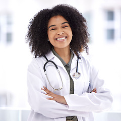 Image showing Doctor, black woman and smile portrait for healthcare with life insurance in hospital for wellness. Face of happy medical professional with arms crossed with pride for career, motivation and medicine