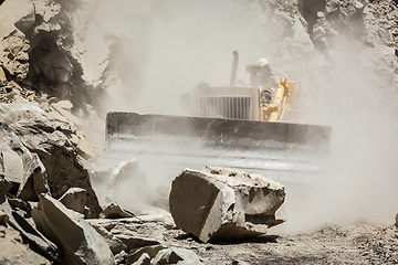 Image showing Bulldozer cleaning landslide on road in Himalayas