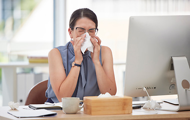 Image showing Sick, computer and blowing nose with woman in office for virus, illness and allergy symptoms. Sneezing, disease and tissue with employee suffering with infection at desk for flu, fever and cold