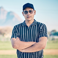 Image showing Man, baseball and portrait of referee with arms crossed ready for game, rules or professional match at pitch. Confident and serious male sports expert in leadership or management for sport fitness