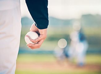 Image showing Baseball player, ball and athlete or pitcher hand in a competitive match or game on the sports field for training. Closeup, sportsman and person playing a sport or softball as exercise and fitness