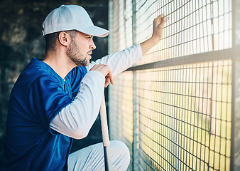 Image showing Baseball, dugout and man watching game holding bat, concentration, competition and sport. Fitness, health and serious sports player waiting for turn to play in fun practice match at stadium or field.