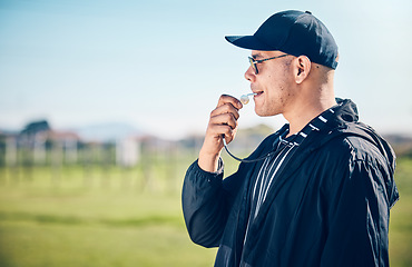 Image showing Coach, blowing whistle and sports training on a field with a man outdoor for competition or challenge. Fitness trainer or teacher person on grass for athlete game, coaching and pitch time strategy