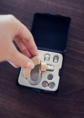 Image showing Disability, hearing aid and healthcare with hands of woman for ear implant, medical and technology. Medicine, audiology and listening devices for deaf with patient for sound, communication and help