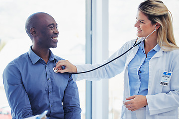 Image showing Doctor woman, patient and consultation with stethoscope in hospital for healthcare or health insurance. Black man and cardiologist person talking about lungs, breathing and advice for healthy heart