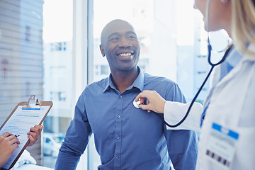 Image showing Cardiology doctor, patient and checkup of people in healthcare consultation, listening to heart and hospital care. Black man and cardiologist woman or medical professional consulting with stethoscope