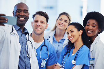 Image showing Healthcare, selfie and team of doctors at hospital, happy and proud, smile and bond on blurred background. Medical, diversity and group pose for photo, profile picture or website homepage update