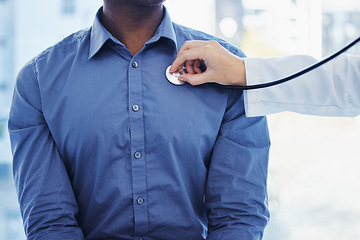 Image showing Doctor, patient and consultation with stethoscope on heart in hospital for healthcare or health insurance. Black man and cardiology person check lungs, breathing and wellness of body and organ