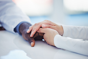 Image showing Hands, healthcare or comfort with a doctor and patient in a hospital during an appointment or checkup. Medical, support and trust with a medicine professional showing empathy while consulting