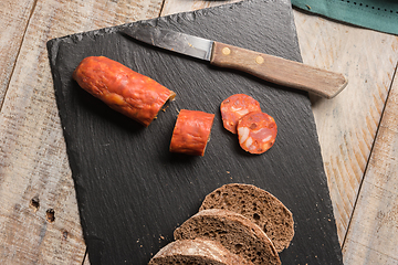 Image showing Malt loaf bread and chorizo slices
