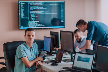 Image showing Programmers engrossed in deep collaboration, diligently working together to solve complex problems and develop innovative mobile applications with seamless functionality.