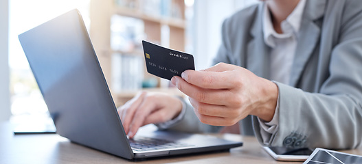 Image showing Hands, laptop and credit card for ecommerce, online shopping or banking on the office desk. Hand of business person or shopper typing on computer for internet purchase, bank app or transaction