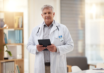 Image showing Tablet, hospital and portrait of senior doctor online for research, telehealth and medical consulting. Healthcare clinic, insurance and man on digital tech for patient data, wellness app and internet