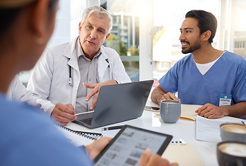 Image showing Team work, planning or doctors in meeting for a strategy or working on laptop in hospital for healthcare. Senior, medical research or nurses talking, speaking or helping innovation or ideas together