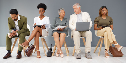 Image showing HR, technology and business people waiting in line for an interview during recruitment. Hiring, resume or cv with a man and woman employee sitting in a human resources candidate line for opportunity