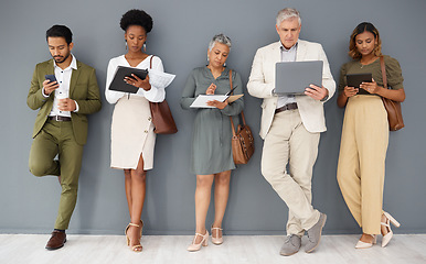 Image showing Office wall, row and business people with technology for networking, internet and job application. Recruitment, hiring line and group of workers on tablet, laptop and phone for interview opportunity