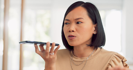 Image showing Asian woman, angry and phone call conversation in office for online business communication, employee stress and anxiety. Frustrated female, smartphone call and upset for online networking conflict