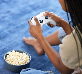 Image showing Woman, video games and hands playing on home floor with popcorn for online gaming, gamepad and relax. Gamer person play on console, joystick or control for esports, streaming and cyber world tech