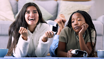 Image showing Gaming, winner and women playing a video game and girl celebrating in a home, house or apartment. Friends, console and people with joystick and jealous person due to victory with controller