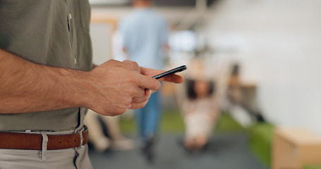 Image showing Phone, startup workspace and man hands typing in creative networking, social media or email on mobile chat. Busy, planning and worker, person or employee hand holding smartphone for app communication