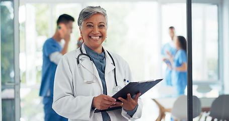 Image showing Healthcare, medicine and face of a mature doctor for service, hospital working and happy with results. Surgery, cardiology and portrait of a medical nurse with documents, notes and clinic paperwork