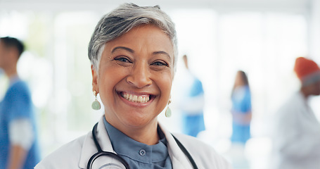 Image showing Face, doctor and woman laughing in hospital ready for tasks, goals or targets. Leadership, senior or portrait of comic healthcare worker or female medical physician happy with career or job at clinic