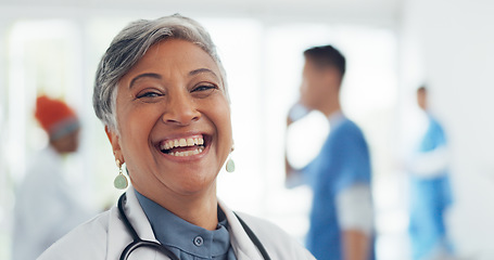 Image showing Face, doctor and woman laughing in hospital ready for tasks, goals or targets. Leadership, senior or portrait of comic healthcare worker or female medical physician happy with career or job at clinic